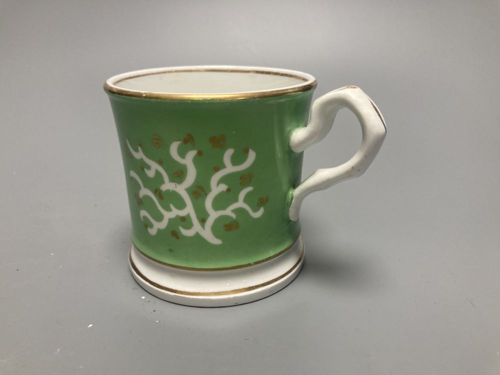 Two Meissen onion pattern shell-shaped dishes, width 19cm, and an English porcelain cabinet cup, inscribed in gilt, Think on me